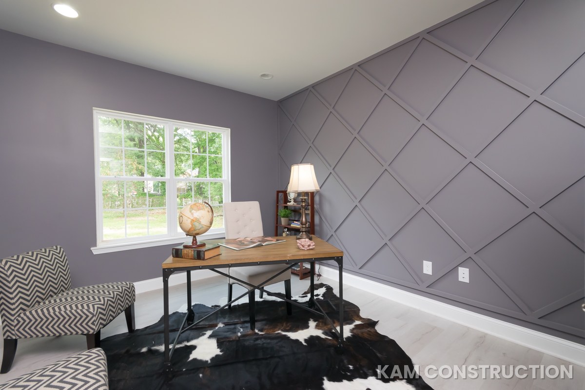 Home office with patterned accent wall