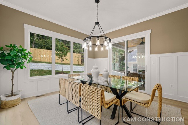 Dining room with wainscoting and rattan chairs