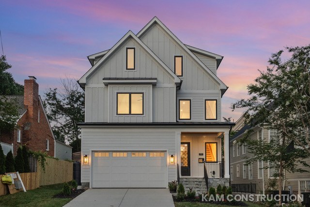 Finished modern farmhouse home exterior at dusk