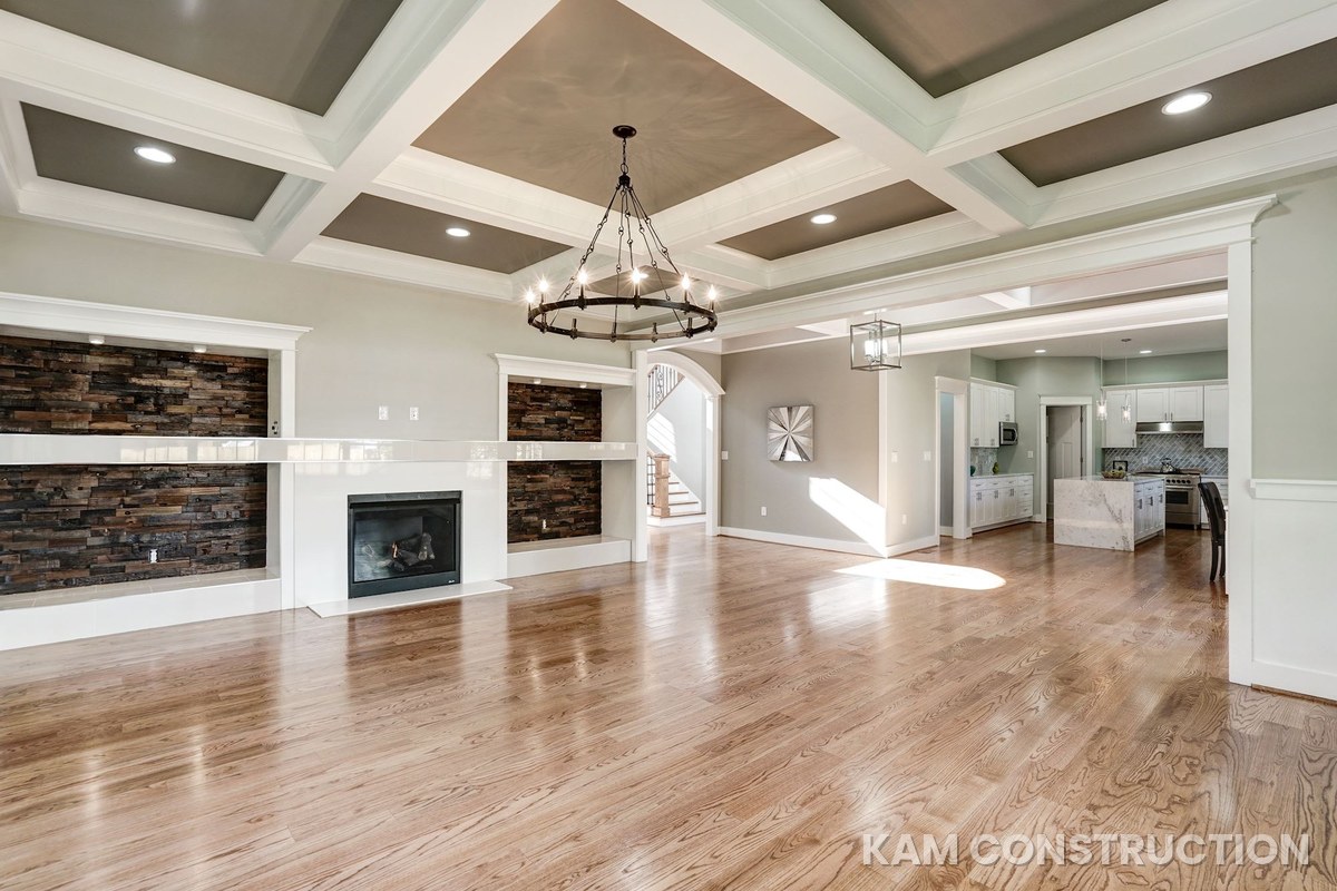 Great room with reclaimed wood fireplace wall