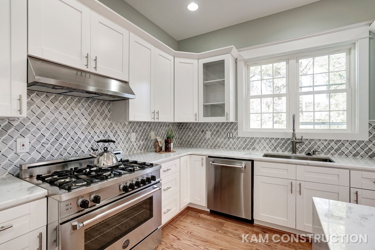 Kitchen with professional range and diamond-pattern tile backsplash