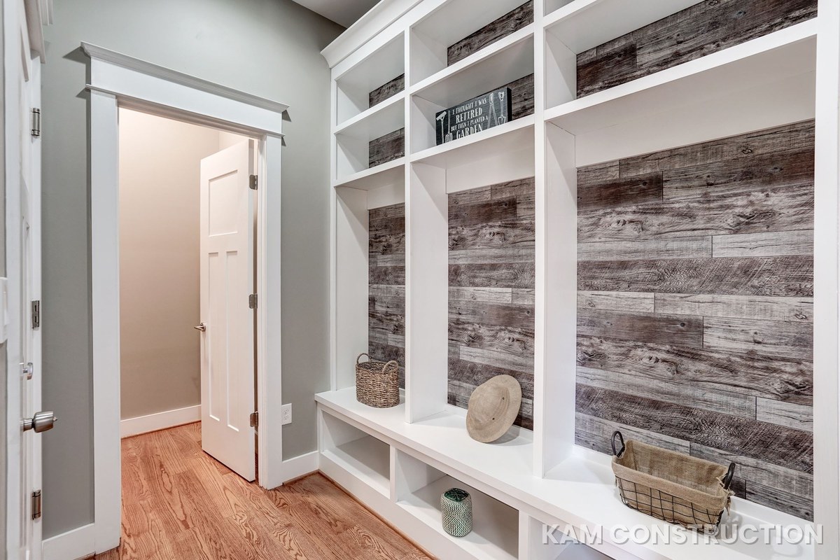 Custom mudroom lockers with reclaimed wood accent